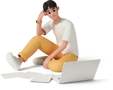 a young man sitting on floor near laptop